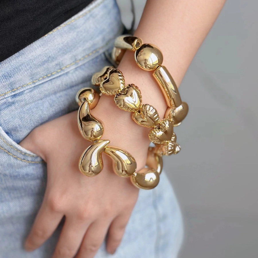 Pulsera Asimétrica de Cobre con Diseño de Globo y Motivo de Gotas de Agua en Forma de Rombos