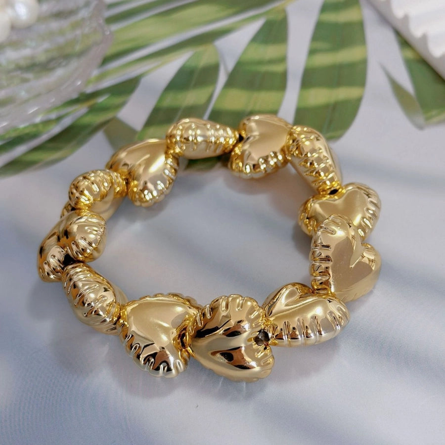 Pulsera Asimétrica de Cobre con Diseño de Globo y Motivo de Gotas de Agua en Forma de Rombos