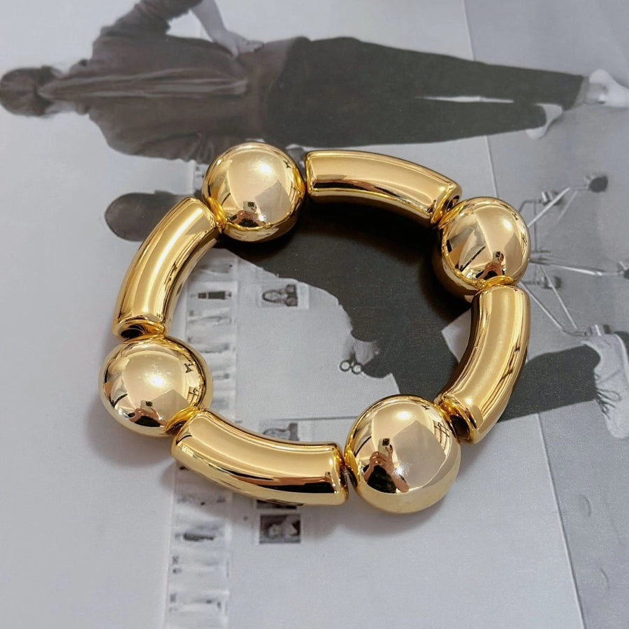 Pulsera Asimétrica de Cobre con Diseño de Globo y Motivo de Gotas de Agua en Forma de Rombos