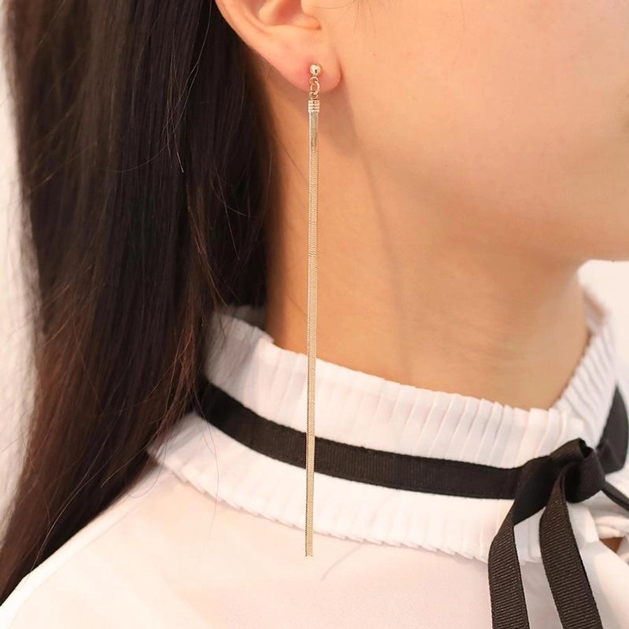 Aretes de Borla con Cadena Larga - Elegancia y Estilo Moderno